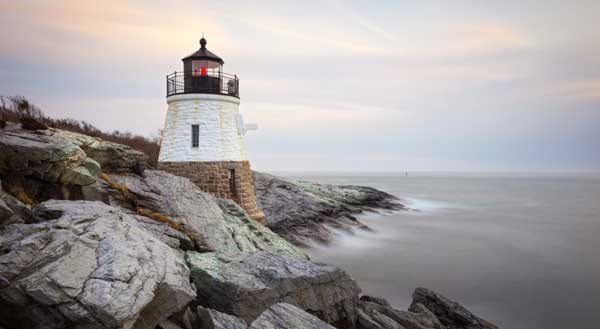 A lighthouse on the rocky coast of New England