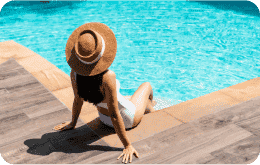 woman sitting by pool