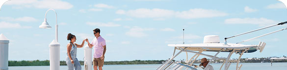 A couple boarding a charter boat.