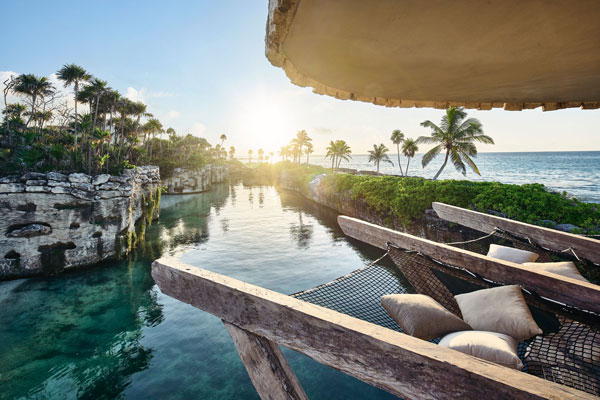 resort view overlooking ocean and poolside