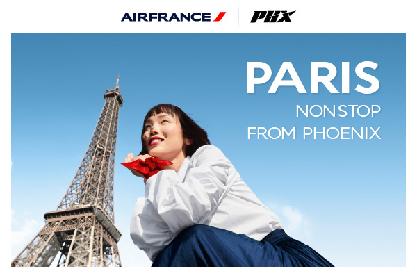 Person starting at sky with Eiffel Tower in background - Air France - PHX - Paris Nonstop from Phoenix