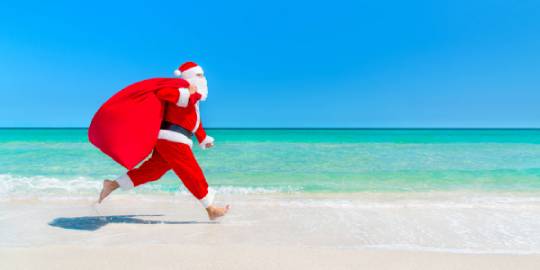 Santa running on the beach