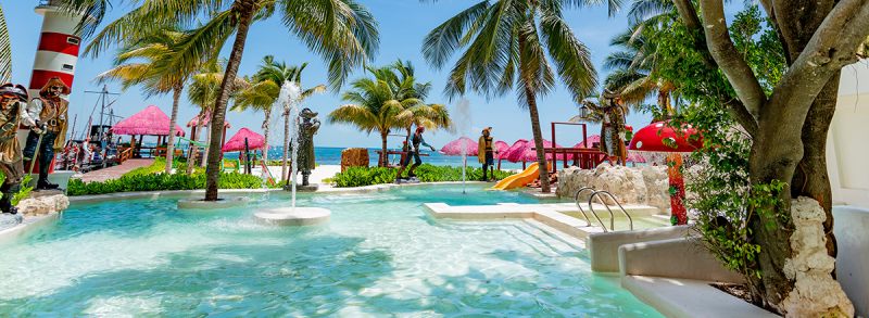Shallow pool with mushroom fountain and ocean view